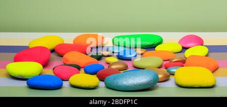 Multi coloured  stones lying on a multi-coloured  background Stock Photo