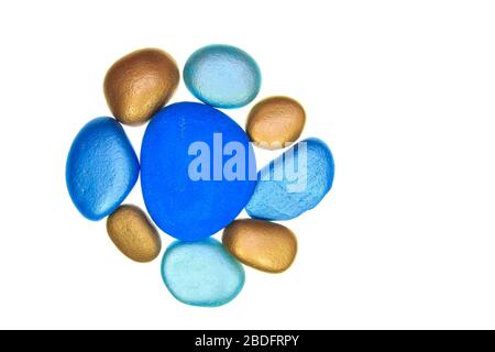 Group of blue and gold coloured stones isolated on a white backgroiund Stock Photo