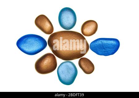 Group of multi coloured painted stones isolated on a white background Stock Photo