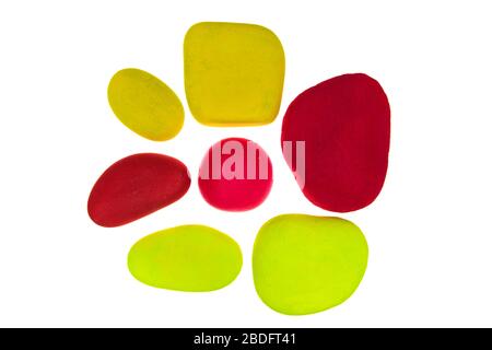 Group of multi coloured painted stones isolated on a white background Stock Photo