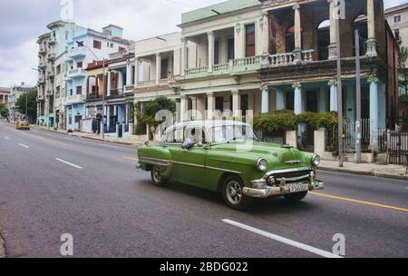 Vintage automobiles and crumbling colonial architecture, Havana, Cuba