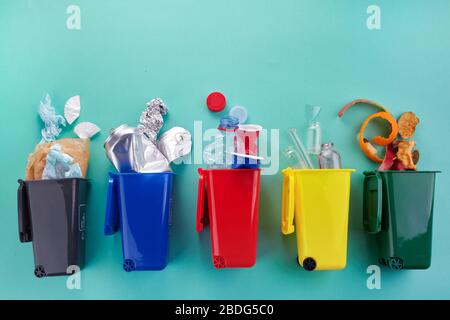 Garbage recycling in flat style on mint background. Garbage collection. Stock Photo