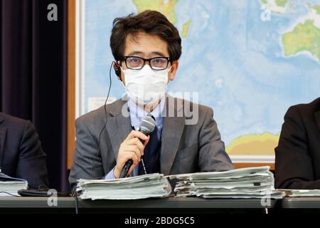 April 8, 2020, Tokyo, Japan: Yasuyuki Sahara Senior Assistant Minister for Global Health, Minister's Secretariat, Ministry of Health, Labor and Welfare, wearing a face mask, speaks during a news conference at the Ministry of Foreign Affairs of Japan (MOFA). Representatives of the Ministries of Japan (Cabinet Secretariat, Cabinet Office, Ministry of Health, Labour and Welfare and Ministry of Foreign Affairs) spoke about the revision of basic policies to prevent and control of the novel coronavirus spread in Japan. The conference came a day after Japanese Prime Minister Shinzo Abe declared a sta Stock Photo