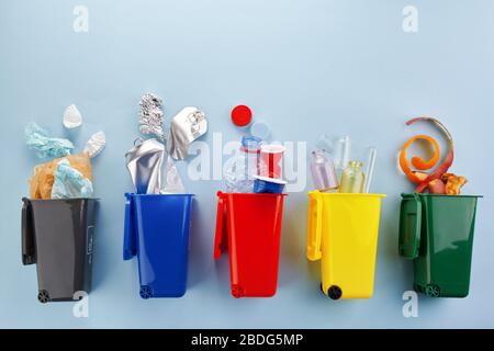 Garbage recycling in flat style on blue background. Garbage collection. Stock Photo
