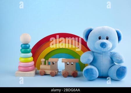 Baby toys collection on blue pastel color background. Education concept. Stock Photo