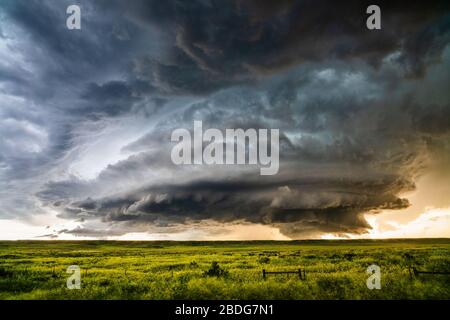 Dark, dramatic supercell storm with ominous clouds over a the plains near Grass Range, Montana Stock Photo
