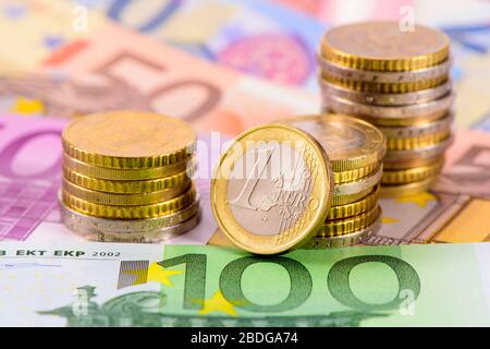 heap of banknotes of Euo currency with coins Stock Photo