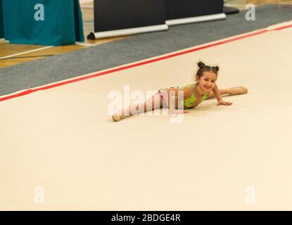 Portrait of a young gymnast. Portrait of a 7 years old girl in rhythmic gymnastics competitions Stock Photo
