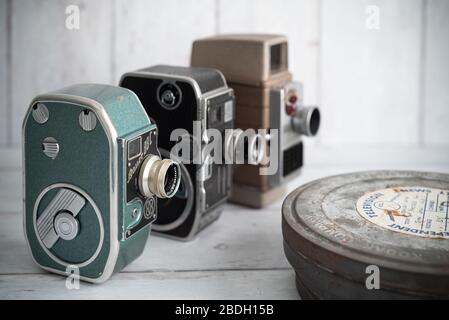 Old 35mm film canisters and vintage 8mm cine / movie cameras - still life  Stock Photo - Alamy