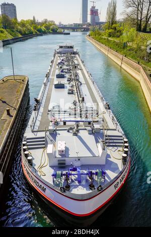 A barge on Rhine river approaching the river lock in Birsfelden, Basel canton, Switzerland. Stock Photo