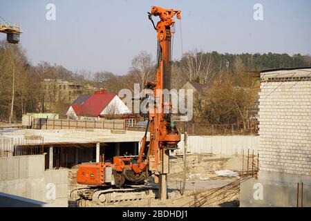 Construction site with pole drilling machine Stock Photo