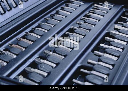 Black plastic box with bits for screwdriver close up Stock Photo