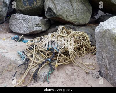 Pollution beach micro plastic and commercial fishing industry plastic rope discard at sea. Cornwall UK. Credit: Robert Taylor/Alamy. Stock Photo