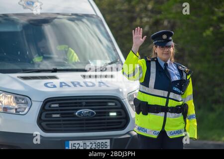 Ashbourne, Ireland. 08th Apr, 2020. Members of An Garda Síochána, more commonly referred to as the Gardaí or 'the Guards', is the police service of the Republic of Ireland seen today manning a checkpoint outside Ashbourne, County Meath to ask drivers where they are going or coming from. The Irish Government has given An Garda Síochána sweeping new powers to enforce restrictions on public movement due to the Covid-19 pandemic.Gardaí can now arrest and detain people they deem to be non-compliant with restrictions in place on public movement. These extraordinary enforcement powers are in place fr Stock Photo
