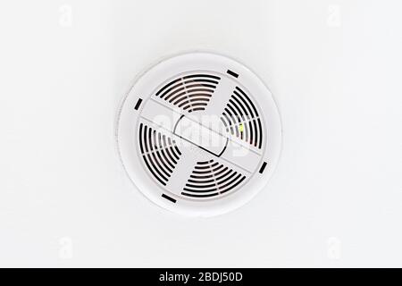 Ceiling mounted electrical smoke detector Stock Photo