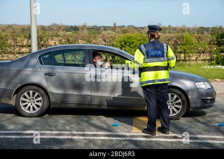 Ashbourne, Ireland. 08th Apr, 2020. 8th April, 2020.Members of An Garda Síochána, more commonly referred to as the Gardaí or 'the Guards', is the police service of the Republic of Ireland seen today manning a checkpoint outside Ashbourne, County Meath to ask drivers where they are going or coming from. The Irish Government has given An Garda Síochána sweeping new powers to enforce restrictions on public movement due to the Covid-19 pandemic.Gardaí can now arrest and detain people they deem to be non-compliant with restrictions in place on public movement. These extraordinary enforcement powers Stock Photo