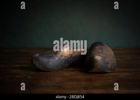 A pair of clogs or wooden shoes typical for the Dutch culture in stillife setting, Holland or The Netherlands Stock Photo