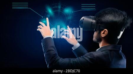 Businessman In VR Glasses Touching Panel Pressing Buttons, Blue Background Stock Photo