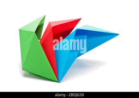 Green, red and blue paper ship side isolated on the white Stock Photo