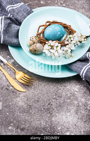 Easter table setting with blue egg Stock Photo