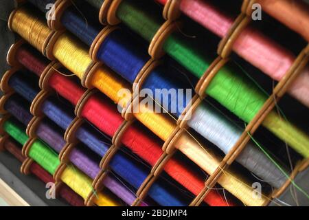 Colorful spools of cotton sewing thread Stock Photo