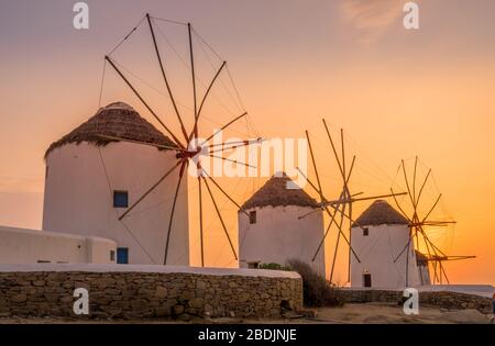 Mykonos, Greece - Oct 14, 2019.  Sun set view of famous and traditional greek windmills in Mykonos island,