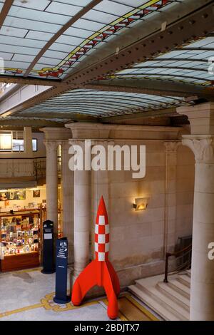 The entrance hall of Belgian Comic Strip Center with Tintin rocket.Brussels.Belgium