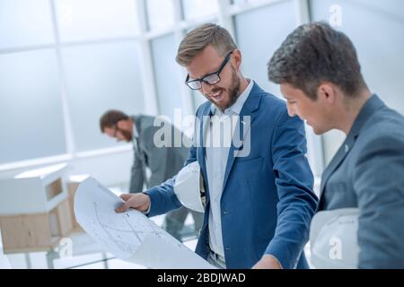 colleagues architects discussing sketches of the new project Stock Photo