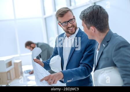 colleagues architects discussing sketches of the new project Stock Photo