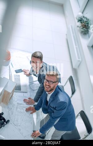 top view. smiling fellow architects looking at the camera Stock Photo
