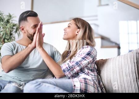 young couple giving each other a high five Stock Photo