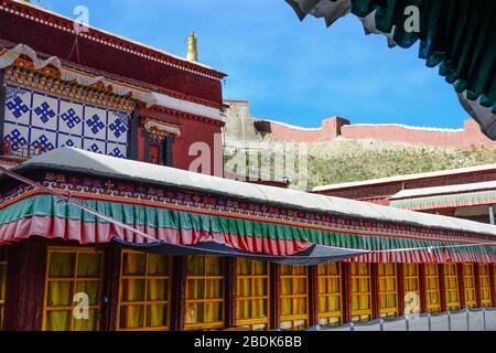 The high red-walled compound in the far north of Gyantse houses Palcho Monastery in the autonomous region of Tibet. Stock Photo