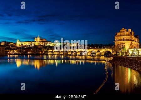 View at night of Charles Bridge reflected in the Vltava River, Prague Czech Republic Stock Photo
