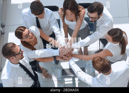 top view.employees of the company making a tower out of hands Stock Photo