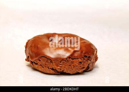 Chocolate frosted donut, by James D Coppinger/Dembinsky Photo Assoc Stock Photo
