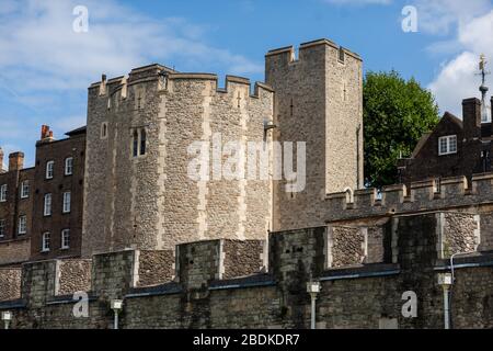 The exterior walls, towers and buildings of the Tower of London, that is an iconic landmark of Central London. Stock Photo