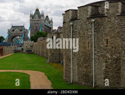 Tower Bridge is seen from various locations inside and outside The Tower of London in Central London. Stock Photo