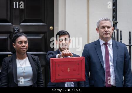 Budget 2020: Chancellor Rishi Sunak poses outside 11 Downing Street with the red Budget box before delivering his first budget statement. London, UK