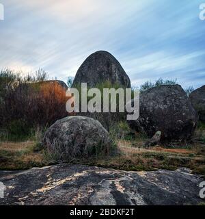 Boulders scattered on the granite rock outcrop at Boulder Rock, Karragullen, Western Australia Stock Photo