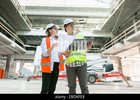 Industrial portrait of male and female construction engineers Stock Photo