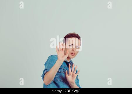 Scared Hand Rised Up scared woman raising hands up in defense afraid about to be attacked or ...