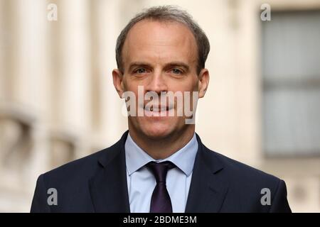 (200409) -- LONDON, April 9, 2020 (Xinhua) -- British Foreign Secretary Dominic Raab arrives at 10 Downing Street for a meeting in London, Britain on April 8, 2020. During Wednesday's Downing Street daily press briefing, Chancellor of the Exchequer Rishi Sunak said Prime Minister Boris Johnson's condition is improving and remains in intensive care. Johnson was admitted to St Thomas' Hospital in London with 'persistent symptoms' on Sunday night, 10 days after testing positive for COVID-19. He was moved into intensive care on Monday night after his coronavirus symptoms worsened. (Photo by Ti Stock Photo