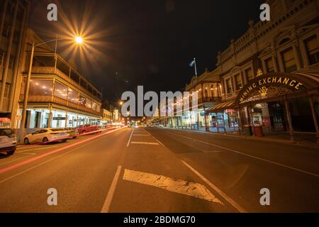 Ballarat Australia - March 15 2020; Wide angle stree view of Mair Street at night  with Mining Exchange building among other Victorian buildings under Stock Photo