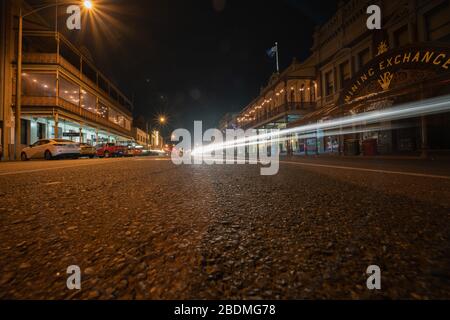 Ballarat Australia - March 15 2020; Wide angle stree view of Mair Street at night  with Mining Exchange building among other Victorian buildings under Stock Photo