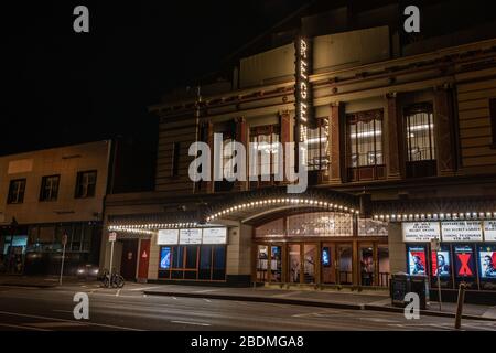 Ballarat Australia - March 15 2020; Wide angle street scene of illuminated art deco style Regent Theatre on Mair Street at night  under street light i Stock Photo