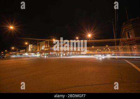 Ballarat Australia - March 15 2020; Mair Street at night  with its Victorian buildings under street light in historic town on intersection of Mair and Stock Photo