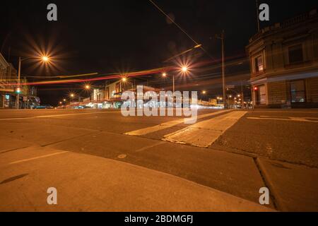 Ballarat Australia - March 15 2020; Mair Street at night  with its Victorian buildings under street light in historic town on intersection of Mair and Stock Photo