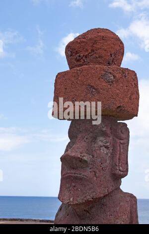 Moai head with pukao carved from red scoria Stock Photo