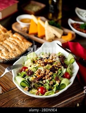 vegetable salad with prunes, nuts and corn Stock Photo