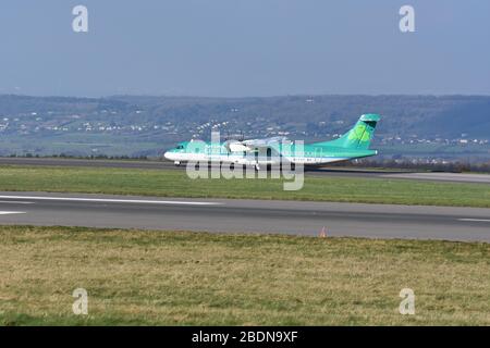 A small Aer Lingus regional airline propeller aeroplane at Bristol Airport, Europe, United Kingdom Stock Photo